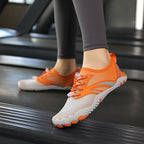 Orange unisex shoes for fitness, wide toe comfortable fit and good foot health worn by female model