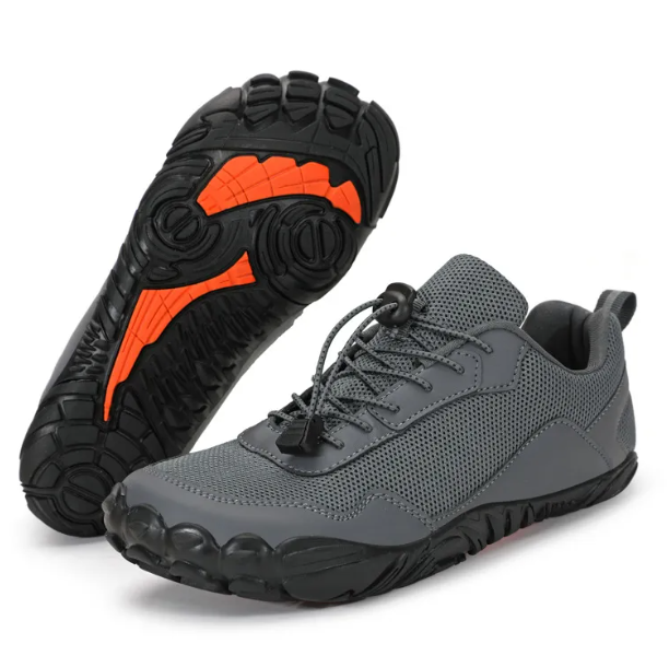 Mens Grey Velocity shoes with a black and orange sole. Wide toe for natural movement, built for maximum comfort.