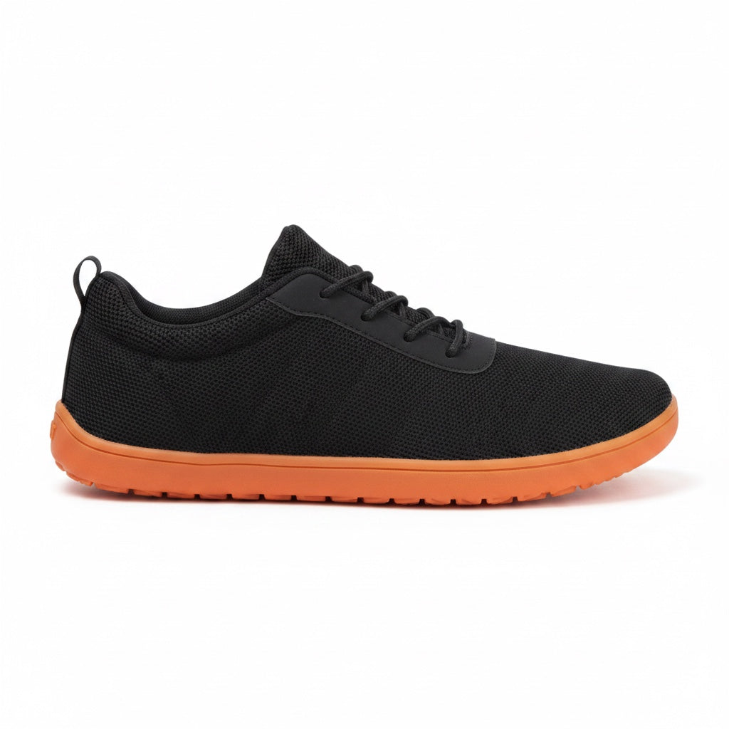 Black Urban Barefoot Shoes shown from the side, highlighting the lightweight everyday design.