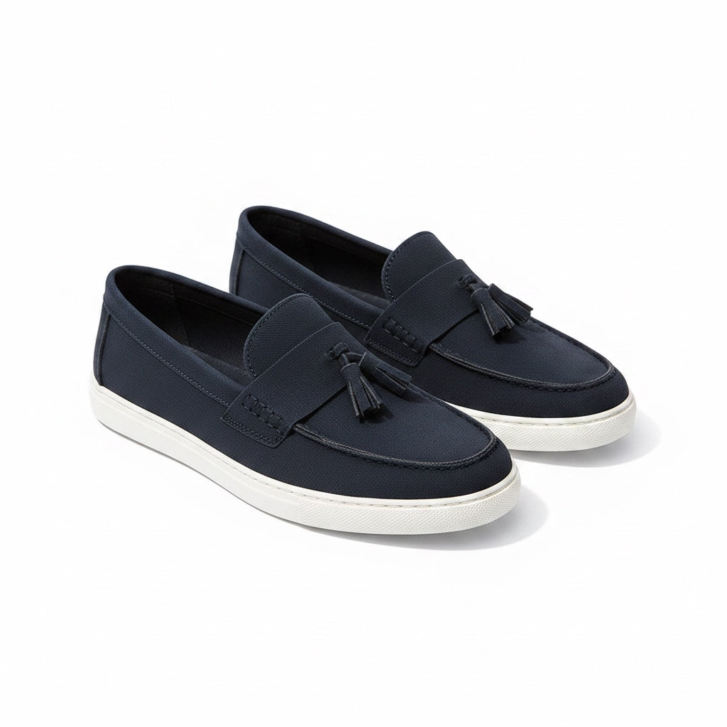Navy blue mens loafers with tassel, white sole. Made with suede to leave a quality and elegant finish.