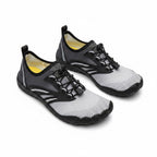 Grey barefoot shoes with black laces and rubber sole. Wide toe for natural movement.