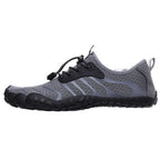 Grey barefoot shoes with a black sole. Wide toe for extra comfort and natural movement