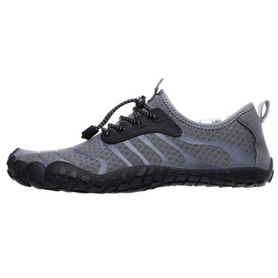 Grey barefoot shoes with a black sole. Wide toe for extra comfort and natural movement