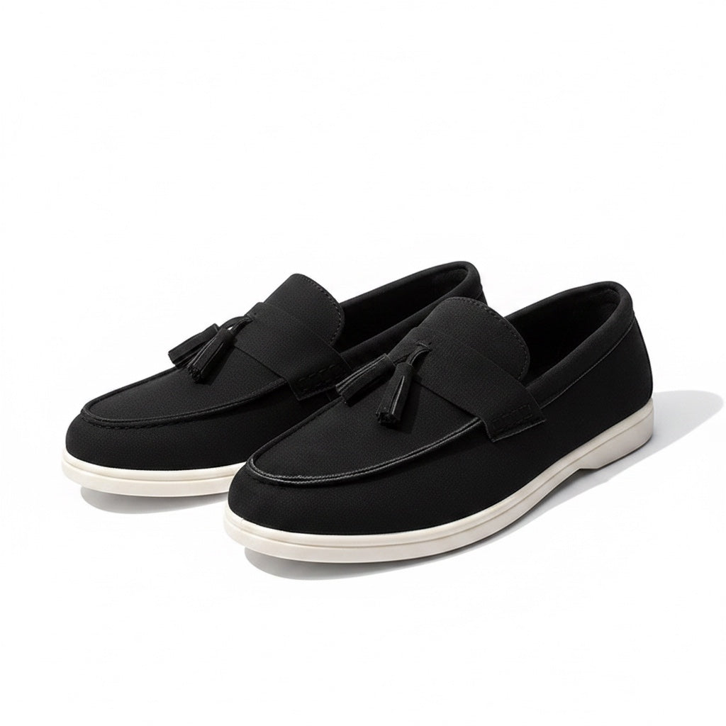 Black loafers with white soles for men, perfect for work or leisure. Comfortable and stylish.
