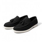 Black loafers with white soles for men, perfect for work or leisure. Comfortable and stylish.
