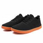 Casual black Urban barefoot shoes with an orange sole. Wide toe for natural comfort. knit finish for added quality.