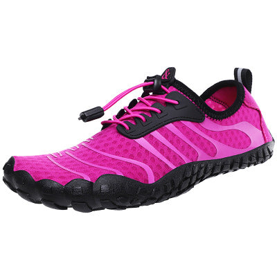 Pink unisex water shoe with black sole. Wide toe for maximum comfort.